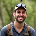 Portrait of Alex Thompson, Lead Guide & Ecologist, smiling outdoors.